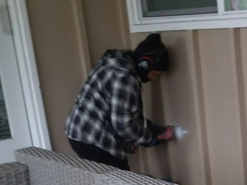 Professional electrician installing an exterior outlet in Mountain Home