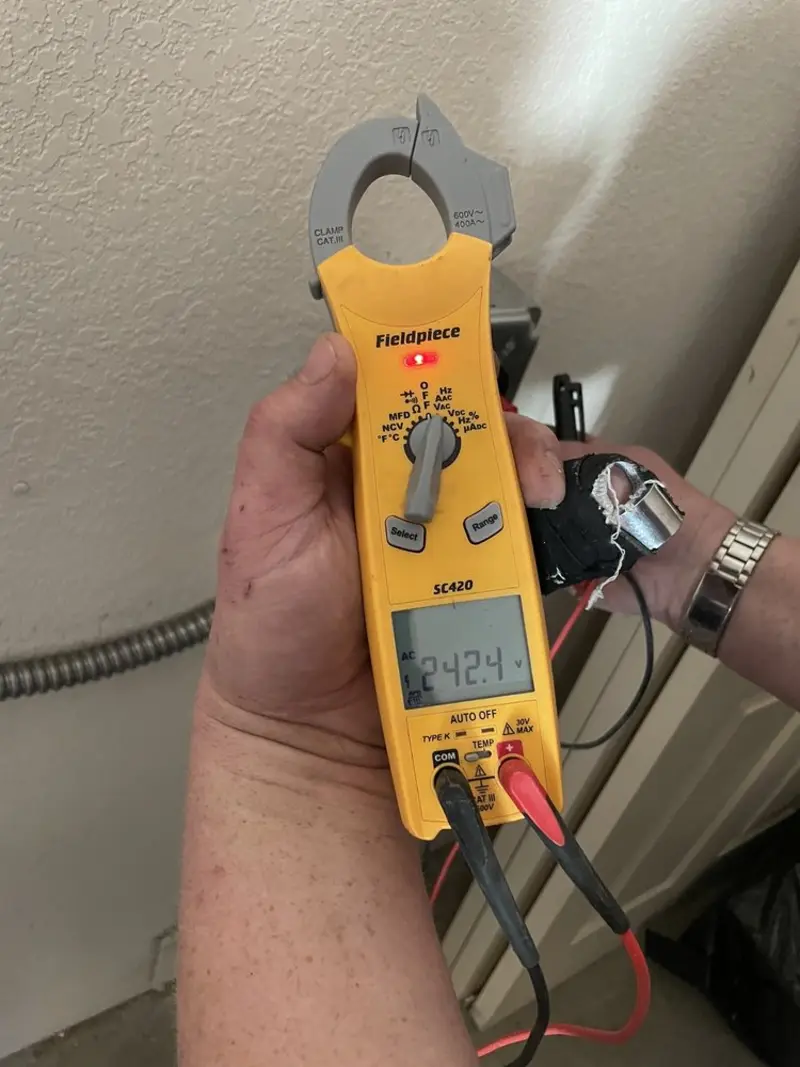 Voltage testing with clamp meter during Recessed Lighting Installation in Mountain Home